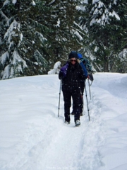Snowshoes off on hard pack trail