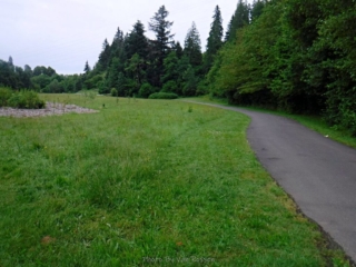 Trail passes through large open fields