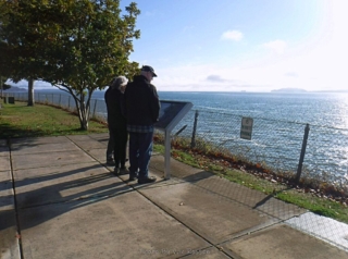 Reading info sign at Dismal Nitch.