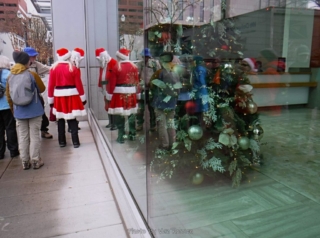 Tom Pointing out some wood work to Santa