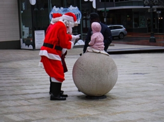 Santa pointing to mom coming