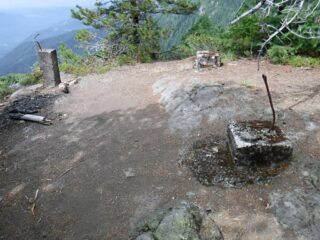Foundation of former fire lookout on cliff edge