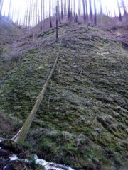 It is a narrow gorge with high stone walls