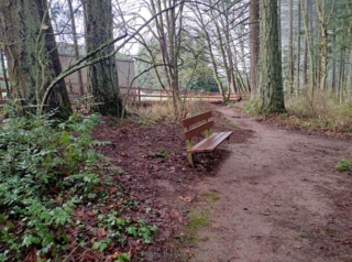 The upper trail passes by housing