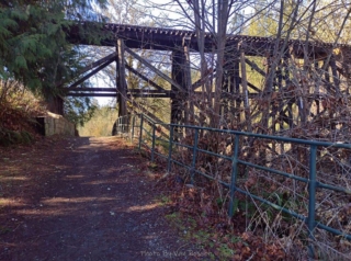 An historic railroad trestle divides the park