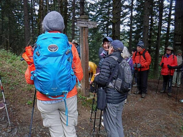 Taking a short break at the trail sign